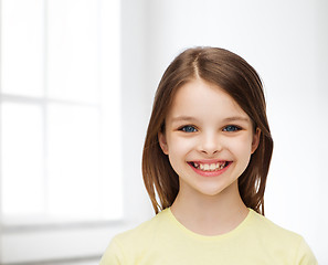 Image showing smiling little girl over white background