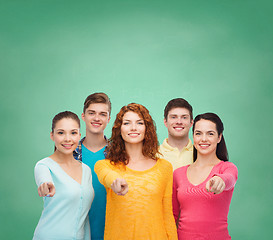 Image showing group of smiling teenagers over green board