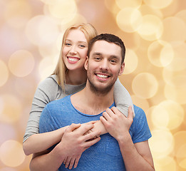 Image showing smiling couple hugging