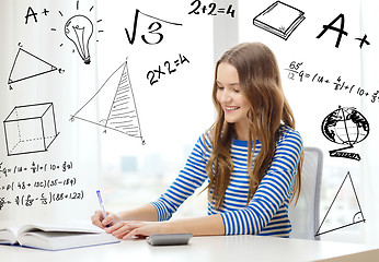 Image showing student girl with book, notebook and calculator