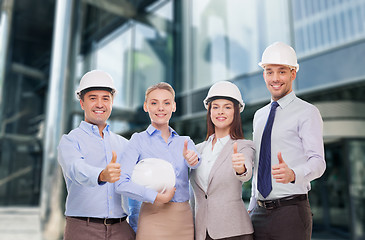 Image showing happy business team in office showing thumbs up