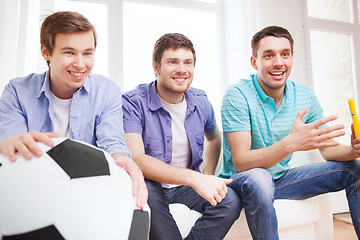 Image showing happy male friends with vuvuzela