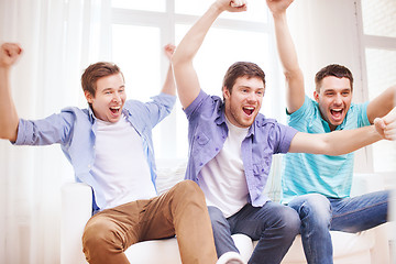 Image showing happy male friends at home