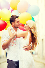 Image showing couple with colorful balloons