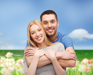 Image showing smiling couple hugging