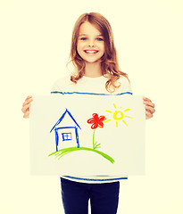 Image showing smiling little child holding picture of house