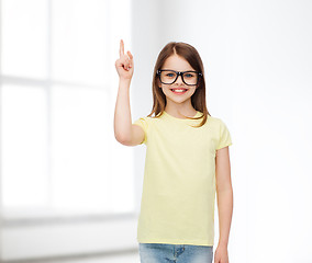 Image showing smiling cute little girl in black eyeglasses