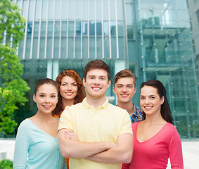 Image showing group of smiling teenagers over city background