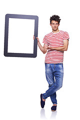 Image showing Full length man holding empty frame