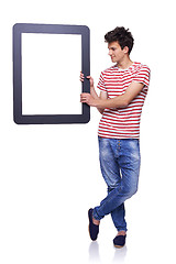 Image showing Full length man holding empty frame