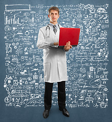 Image showing doctor male in suit with laptop in his hands