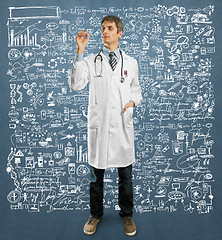 Image showing Doctor male writing something 