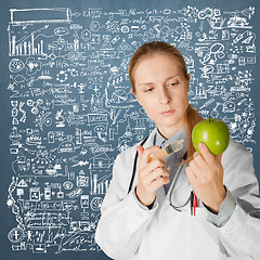 Image showing scientist woman with apple