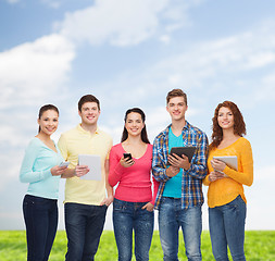 Image showing group of teenagers with smartphones and tablet pc