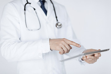 Image showing male doctor holding tablet pc