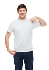 Image showing smiling young man in blank white t-shirt