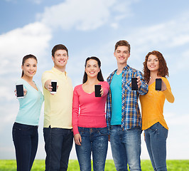 Image showing group of smiling teenagers with smartphones