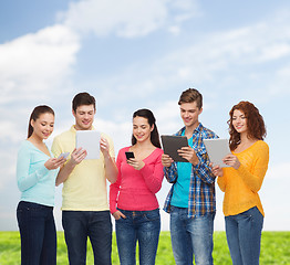 Image showing group of teenagers with smartphones and tablet pc