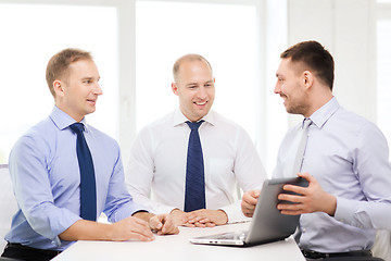 Image showing business team working with laptop in office