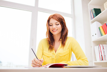 Image showing smiling businesswoman or student with tablet pc