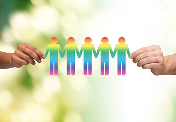 Image showing close up of hands holding paper chain gay people