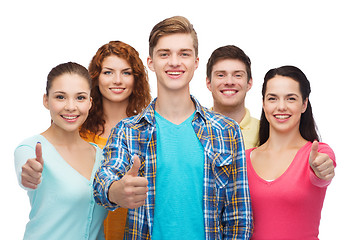 Image showing group of smiling teenagers showing thumbs up