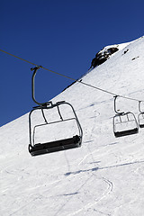 Image showing Chair-lift in ski resort at sun day