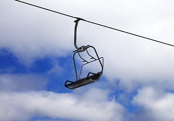 Image showing Chair-lift and cloudy sky