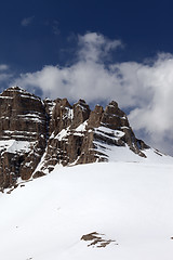 Image showing Snowy rock and sky with clouds