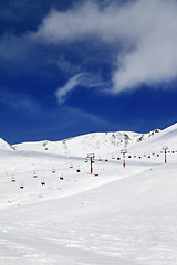 Image showing Chair-lift and ski slope at sun day