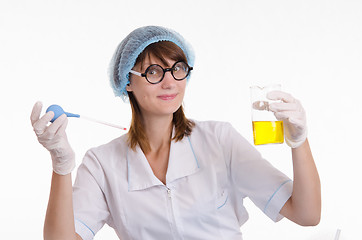 Image showing Chemist with a pipette and bulb