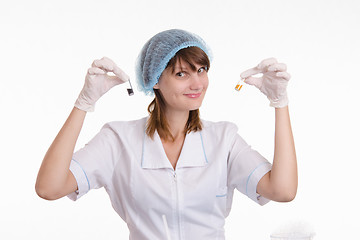 Image showing Chemistry teacher with powders in vials