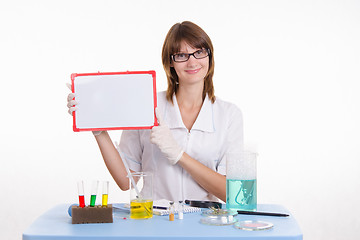 Image showing Chemist holding a tablet