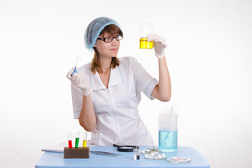 Image showing Chemistry teacher considers the result of experience