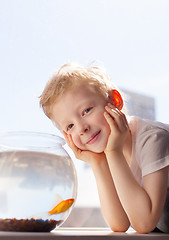 Image showing kid and goldfish