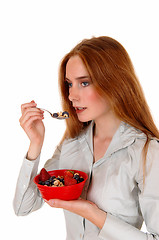 Image showing Woman eating breakfast.