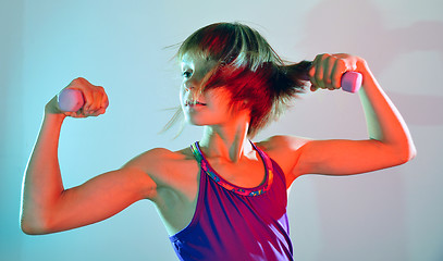 Image showing child exercising with dumbells