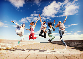 Image showing group of teenagers jumping