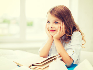 Image showing student girl writing in notebook at school