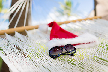 Image showing hammock with santa helper hat and shades