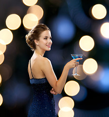 Image showing smiling woman holding cocktail