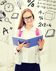 Image showing girl reading book at school