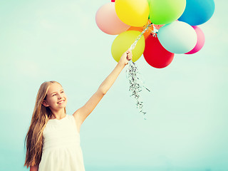 Image showing happy girl with colorful balloons