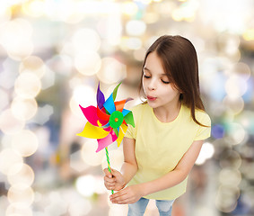 Image showing smiling child with colorful windmill toy