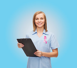 Image showing female nurse with stethoscope and clipboard