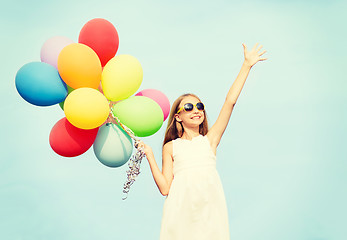 Image showing happy girl with colorful balloons