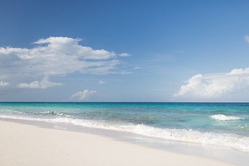 Image showing blue sea or ocean, white sand and sky with clouds