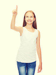 Image showing girl in blank white shirt pointing to something