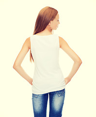 Image showing teenage girl in blank white shirt from the back