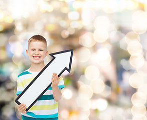 Image showing smiling little boy with blank arrow pointing right